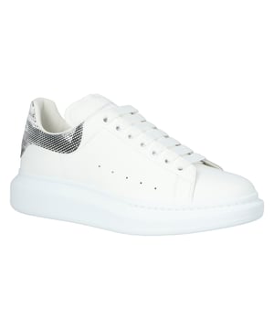 - Leather upper.
- Rubber sole.
- Logo detail.
- Colour: white, grey.
- These Oversized sneakers from Alexander McQueen are an iconic style. 
- Designed with a leather upper, they boast a round toe, low-top silhouette and a blown-up rubber sole. 
- They're finished with flat laces, a contrast graphic heel tab with a logo stamp, and a padded collar for extra cushioning.
- Made in Italy