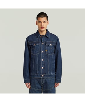 Shirt collar. Shank button closure. Chest pockets with flap. Slim welt pockets at the waist. Slim welt pockets at the waist. Button closure. The Arc 3D denim jacket follows the same G-STAR 3D design principles as the Arc jeans. Where twisted seams create a bowed fit that turns around the sleeve. This means a slim fit with comfort and mobility. 62% Cotton, 38% Lyocell. Rigid. Denim, weight 11.3 oz. Slim