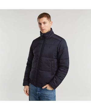 Raised collar. Zipper closure. Welt pockets at the waist, hidden snap button. Elasticated inner cuffs. Hanger loop inside. Zip closure. Padded jacket Quilted fis designed in a straight fit and offers a raised collar. Welt pockets at the waist are secured with a hidden snap button. An elasticated hemline and inner cuffs add to a comfortable fit. 100% Polyester (Recycled). Woven