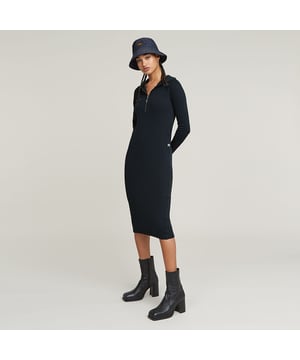Hood. Zipper closure. Pockets caught in the side seams. Zip closure. Hooded Dress Half Zip offers a knee length design with long sleeves. Pockets are caught in the front seams. The comfy hood with short zipper completes it. 100% Organic cotton. Built-in stretch. Rib jersey. Slim