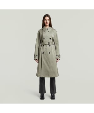 Revers collar, top button for full closure. Double breasted closure and belt. Adjustable tabs at the sleeve, button closure. Waist pockets, reverse flap with button, inner pocket. Back slit. Button closure. Trench High is designed in a loose fit and offers an authentic double breasted closure. Use the top button to fully close the front. The waist pockets show a reversed flap. Inside, another pocket is created. Use the belt to emphasize the waist. The deep slit at the back adds character. 97% Cotton, 3% Elastane. Stretch twill woven. Loose
