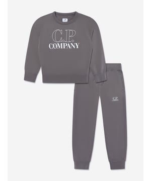 Elevate your young gentleman's ensemble with the CP Company Boys Logo Tracksuit in Grey. Expertly crafted for SS2025, this tracksuit is the pinnacle of luxury and utility. Iconic Lens Detail Celebrated CP Company lens on the sleeve adds a distinctive touch. Premium Comfort Constructed from superior quality fabrics, ensuring comfort during any activity. Subtle Branding Understated logo detailing offers a chic and elegant look. Versatile Style Ideal for both casual outings and stylish lounging at home.Refresh his wardrobe with flair sophistication! Order today.
