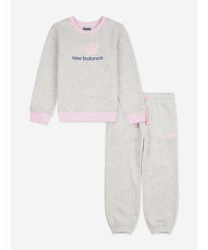 Discover the elegance practicality of the New Balance Apparel Girls Logo Tracksuit in Grey, an impeccable choice for SS2025. Crafted meticulously for chic young ladies, this tracksuit merges fashion with function Iconic Brand Motif Stylized New Balance logo ensures a fashionable edge with every outing. Luxurious Comfort Constructed from premium fabrics for a soft, comfortable fit perfect for daily adventures. Stylish Versatility Ideal for both sporty pursuits and casual outings, enhancing any girls wardrobe seamlessly.Elevate her style this season with this exclusive piece. Order now indulge in the blend of comfort and chic design!