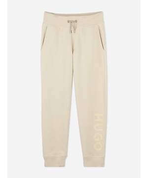 Introducing the exquisite Boys Logo Print Joggers in Beige by Hugo, a quintessential addition to your young gentleman's wardrobe for SS2025. Seamlessly blending luxurious comfort with cutting-edge style, these joggers promise to elevate his ensemble effortlessly. Key features include Distinctive Logo Print Eye-catching design ensuring standout style. Superior Comfort Crafted from premium fabrics for all-day ease. Versatile Beige Perfect for mixing and matching with his favourite tops.Revamp his look with the Hugo Boys Logo Print Joggers in Beige. Order now let his style shine!