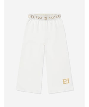 Escada incorporate high standards of elegance and unbeatable glamour into their aesthetics. These girls snow white joggers are woven in beautiful high quality with a tape elasticated waistband and Escada golden print. Straight Hem 95 Cotton, 5 Elastane