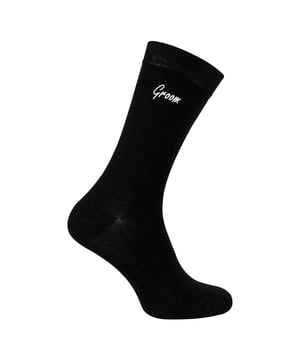 Sock Snob - 1 Pack Mens Wedding Socks: Add a touch of elegance to your wedding day with the Sock Snob 1 Pack Mens Wedding Socks. Designed specifically for key members of the wedding party, these socks are available with personalized labels for Groomsman, Groom, Father of the Groom, Father of the Bride, and Best Man. Choose from classic Navy or Black to perfectly complement your wedding attire. Sized to fit 6-11, these socks provide comfort and style for all-day wear. Made from high-quality, breathable fabric, these socks ensure a soft and luxurious feel, making them ideal for long hours of celebration. Whether you're walking down the aisle, posing for photos, or dancing the night away, these socks are crafted for durability and elegance. These socks also make for a meaningful gift, allowing you to honor the important men in your life with a keepsake they’ll cherish. The timeless design and personalized touch make them suitable for weddings, formal events, or as a thoughtful gesture. Extra Product Details: Styles: Groomsman, Groom, Father of the Groom, Father of the Bride, Best Man Colours: Navy, Black Sizes: 6-11 Material: High-quality, breathable fabric Includes: 1 pair of wedding socks Machine washable for easy care. Elegant, practical, and timeless, Sock Snob Wedding Socks are the perfect choice for your special day. Celebrate in comfort and style while creating lasting memories with these premium socks.