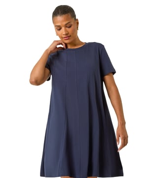 Cotton Panelled Swing Stretch Dress from Roman. Every wardrobe needs a staple dress and this knee-length piece is no exception. Our classic round neckline dress features short sleeves and is made from a comfortable, soft cotton stretch fabric. The panelled swing skirt adds a fun and flirty touch to the look. Pair with a denim jacket and wedged heels for the perfect Spring Summer outfit!