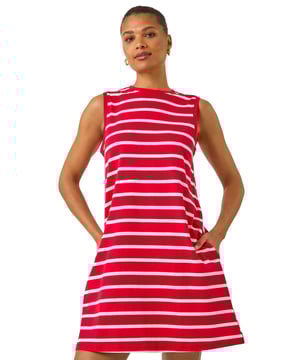 Stripe Jersey A-Line Dress from Roman. Get ready to elevate your Spring Summer wardrobe with this casual stripe dress. Crafted from a soft cotton jersey fabric, this sleeveless style features a classic round neckline and stylish stripes throughout. Designed in a flattering a-line shape, this knee-length dress is perfect for pairing with a denim jacket and wedged heels for a simple outfit!