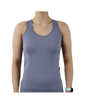 Pretty Polly Active-Wear Vest is a seamless vest which features a patterned mesh panels detail around the neck line for breathability and a racer back design. Perfect for Yoga or Pilates or just relaxing at home. The fabric is soft and comfortable and is predominantly made from recycled yarn.