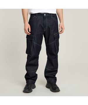 Zip fly. Inset pockets, coin pocket. Cargo pockets at the thigh, hidden snap closure, zip pocket placed behind. Back pockets with flap, hidden snap closure. G-STAR label at the back, made from a leather-like paper fabric. Button & zip closure. Mid waist. The Rovic Jean 3D Loose Denim shows cargo thigh pockets with an additional zipper pocket caught behind one of them. Darts at the knee enhance the 3D effect of these Rovic jeans. 100% Cotton. Rigid. Loose