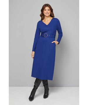 Flattering V-neckline that frames the dcolletage beautifully
        Striking circular buckle belt that cinches the waist for a defined silhouette
        Practical side pockets for everyday essentials
        Versatile midi length perfect for day-to-night styling
        Comfortable ponte jersey fabric with gentle stretch for all-day wear
    
    This sophisticated Wallis midi dress combines effortless style with practical comfort. The flattering V-neckline and waist-defining belt with its distinctive circular buckle create a feminine silhouette that works wonderfully for various daytime occasions. Style with knee-high boots as shown for a polished autumn look, or pair with ballet flats and a denim jacket for casual weekend brunches. The practical side pockets add functionality without compromising on style, while the stretchy ponte jersey fabric ensures you stay comfortable throughout the day. Perfect for family gatherings, lunch dates or office wear, this dress can be accessorised with a statement necklace and crossbody bag for shopping trips, or dressed down with trainers and an oversized cardigan for coffee mornings. A versatile wardrobe staple that combines Wallis's signature sophistication with everyday wearability.