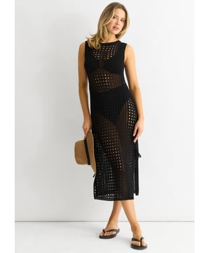 Ervaar moeiteloze stijl en comfort met onze zwarte Crochet Knit Bodycon Midi Dress. Deze jurk, gemaakt van een delicaat gebreid haakwerk, omhelst je lichaam op alle juiste plekken en is perfect voor elke casual gelegenheid. Omarm je rondingen en val op in dit veelzijdige en comfortabele stuk.