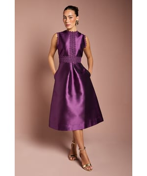Elegant twill fabric with a lustrous sheen
        Intricate lace detailing along the bodice and waistline
        Flattering A-line silhouette with a midi length
        Sleeveless design with a sophisticated round neckline
        Practical side pockets for a touch of functionality
    
    This stunning twill lace dress from Coast is the epitome of refined elegance, perfect for those special occasions that demand a touch of sophistication. The A-line silhouette gracefully skims the body, creating a flattering shape that's both timeless and modern. The intricate lace detailing adds a delicate charm, while the midi length ensures versatility for various formal events. Style this dress with strappy metallic heels and a clutch bag for a polished look at weddings or race days. For cooler evenings, drape a lightweight pashmina over your shoulders. The addition of side pockets offers a practical element to this otherwise formal piece, allowing you to keep small essentials close at hand. Whether you're attending a graduation ceremony or a garden party, this dress will ensure you radiate confidence and style.