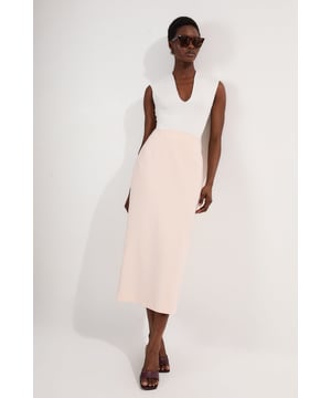 This Karen Millen tailored midi pencil skirt offers the perfect balance of sophistication and practicality for your everyday wardrobe. The compact stretch fabric moulds to your silhouette whilst ensuring all-day comfort and ease of movement. Style with a crisp sleeveless top and strappy sandals for a refined daytime look, or pair with a structured blazer for an effortlessly stylish ensemble perfect for family gatherings or lunch with friends. The functional pocket detail adds a contemporary touch to this timeless piece, whilst the below-knee length creates a flattering line that works brilliantly with both flats and low heels. This versatile skirt can be dressed down with a casual knit and trainers for weekend brunches or styled with a silk blouse for more polished daywear occasions.  Sleek midi pencil skirt Practical side pocket detail Elegant midi length Versatile design