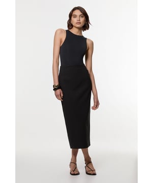 This Karen Millen tailored midi pencil skirt offers the perfect balance of sophistication and practicality for your everyday wardrobe. The compact stretch fabric moulds to your silhouette whilst ensuring all-day comfort and ease of movement. Style with a crisp sleeveless top and strappy sandals for a refined daytime look, or pair with a structured blazer for an effortlessly stylish ensemble perfect for family gatherings or lunch with friends. The functional pocket detail adds a contemporary touch to this timeless piece, whilst the below-knee length creates a flattering line that works brilliantly with both flats and low heels. This versatile skirt can be dressed down with a casual knit and trainers for weekend brunches or styled with a silk blouse for more polished daywear occasions.  Sleek midi pencil skirt Practical side pocket detail Elegant midi length Versatile design