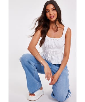 - Scoop neckline - Tie front - Cropped fit - Cami straps - Model height: 5'7" - Model wears uk 8 / us 4 / eur 36 - Always check the wash care label - Cool hand wash with mild detergent