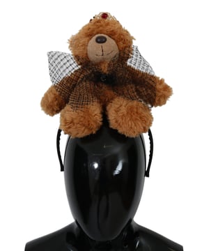 Stunning Dolce & Gabbana Teddy Bear Crystal Crown Hair Band
  100% Authentic and brand new with tags
  Brown color with gold metal detailing
  Crown adorned with red crystals
  Made from 80% PL 5% Crystal and 15% Brass
  One size fits all
  Dolce & Gabbana logo details
  Made in Italy
  Very exclusive and rare item
Material: 80% PL 5% Crystal 15% Brass