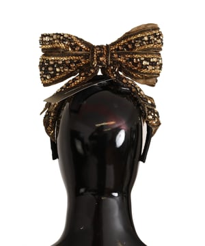 A estrenar con etiquetas y caja.
  100% autentico Dolce & Gabbana.
  Diadema de lazo adornada en oro.
  Coleccion exclusiva MainLine de Dolce & Gabbana.
  Color: Dorado negro.
  Material: 90% seda 10% acetato.
  Cristal: Dorado negro.
  Talla: Talla unica.
  Detalles del logotipo.
  Hecho en Italia.