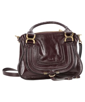 VINTAGE, RRP AS NEW
The Small Marcie Bag by Chloé is a graceful blend of structure and softness, crafted from luxurious shiny burgundy calfskin. Its gently slouched silhouette is accented with intricate saddle stitching, signature gold-tone hardware, and hand-wrapped double handles. The flap is secured with the line’s signature leather tassels, adding a touch of free-spirited charm to a refined classic.


Chloé Small Marcie Bag in Shiny Burgundy Leather
Condition: Very good
Signs of wear: No retail tag, No visible sign of wear., Lightly used but very well maintained. Minor creasing, light worn corners, light scratches.
Packaging: Dust bag
Color: Red | burgundy
Material: Leather | ] leather
Size: One Size | One Size
Measurements: Width: 90; Height: 220; Length: 310; Handle drop: 150; Strap length: 940
SKU: NAPPUDEBA527519W