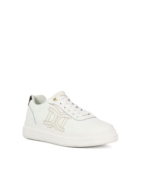 Step into effortless luxury with this standout trainer. This elevated everyday style features our signature stitched double D branding for a subtle yet distinctive touch. Branded gold eyelets and tongue detailing add a polished finish, while the chunky, lightweight gum sole delivers all-day comfort with contemporary appeal. A refined blend of form and function, designed to complement your off-duty wardrobe with ease.