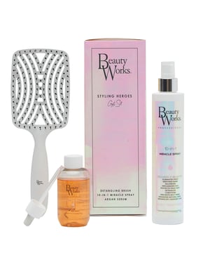 Discover the Beauty Works Styling Heroes Gift Set, your ultimate solution for radiant, healthy hair. This luxurious set includes three essential products: the Beauty Works Detangling Brush, 10-in-1 Miracle Spray (250ml), and Argan Serum (90ml). The detangling brush glides through hair, while the Miracle Spray nourishes and protects against heat damage. The Argan Serum locks in hydration and enhances shine. Elevate your hair care routine with this must-have set!
