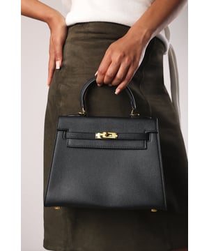 Elevate your everyday ensemble with this Lluvia Top Handle Satchel Mini Tote Bag, a timeless choice for modern elegance. Featuring a structured silhouette and refined grain-textured finish, this handbag blends style and practicality effortlessly. The polished gold-tone turn-lock closure adds a touch of sophistication. Ideal for work or weekend outings, it’s compact yet roomy enough for your essentials. Key Features: • Material: Textured faux leather with contrast stitching • Dimensions: 25cm (L) x 20cm (H) x 11cm (W) • Fastening: Gold-tone turn-lock flap closure • Detail: Minimalist top handle design with structured base and sleek finish 