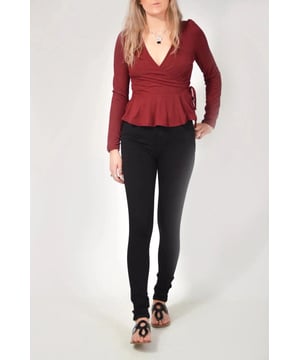 Wear day-to-night, this wrap top is the ultimate day to evening piece that never goes out of style. Whether you dress down with jeans for a low-key vibe or drop jaws with a pair of smart trousers, this is the versatile wardrobe staple that you won't be able to live without. With an elegant gathered puff shoulder, fine rib detailing, this item will be a regular go to.