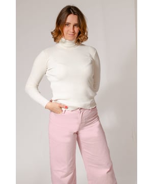 Stay warm and cozy in this fashionable ribbed jumper that offers a textured appearance. Designed with a slim fit, it includes a roll neck and long sleeves for added comfort, making it a versatile addition to your wardrobe. Enjoy the timeless yet modern style of this easy-to-wear staple.

25" Shoulder to Hem.