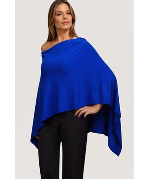 This gorgeous soft knit poncho from Betty Barclay is made from a fine viscose blend knit. In a royal blue hue, this poncho can be worn as a slash neck or cowl neck (simply turn around) and is the perfect cover for summer evenings, or winter parties.
Smooth Fine Knit
Wide Slash Neck
Front 18" Back 29" Shoulder to Hem
These are end of line ex Betty Barclay.
