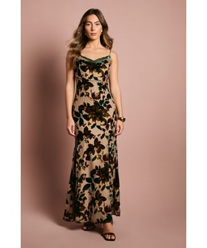 Elegant sleeveless slip dress with delicate adjustable straps for a customised fit
        Sophisticated cowl neckline with contrasting lace insert for added allure
        Figure-flattering jersey fabric that drapes beautifully against the body
        Striking floral pattern creates a dramatic visual impact for special occasions
        Floor-length design with a subtle fishtail hem that enhances movement
    
    Make an unforgettable entrance in this stunning Coast Devour Slip Dress. The elegant cowl neckline with its distinctive lace insert creates a captivating focal point, whilst the sleek silhouette gracefully skims your curves for a truly flattering effect. Perfect for weddings, formal dinners or race day events, this dress commands attention without overwhelming. Style with strappy heels and a clutch bag for classic sophistication, or add statement earrings to amplify the glamour. The versatile design transitions effortlessly from daytime garden parties to evening receptions-simply switch your accessories to suit the occasion. The jersey fabric offers comfortable wear throughout long events, whilst maintaining that polished, luxurious appearance that Coast is renowned for. This dress promises to become a treasured piece in your occasion wear collection.