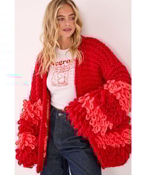 Striking loopy texture creates a bold statement piece with distinctive striped pattern
        Oversized silhouette offers a relaxed, comfortable fit perfect for layering
        Open-front design allows for versatile styling options
        Textured knit with contrasting loopy fringe detailing adds dimension and visual interest
        Wide sleeves provide a contemporary, fashion-forward look
    
    Make a statement with this eye-catching Extreme Stripe Loopy Cardigan from Nasty Gal. The chunky knit construction features a striking combination of smooth and textured stripes, creating a bold visual effect that demands attention. Style this standout piece with a simple white tee and black shorts for a balanced casual look, or throw it over a fitted dress to add texture to your ensemble. The relaxed fit makes it ideal for family gatherings or weekend brunches, whilst the distinctive loopy fringe detail adds artistic flair to even the simplest outfit. Pair with knee-high boots and denim for an autumn-ready ensemble, or layer over a casual dress with trainers for effortless weekend style. This cardigan works brilliantly as the focal point of your outfit, bringing warmth and character to your casual wardrobe.