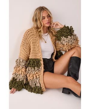 Striking loopy texture creates a bold statement piece with distinctive striped pattern
        Oversized silhouette offers a relaxed, comfortable fit perfect for layering
        Open-front design allows for versatile styling options
        Textured knit with contrasting loopy fringe detailing adds dimension and visual interest
        Wide sleeves provide a contemporary, fashion-forward look
    
    Make a statement with this eye-catching Extreme Stripe Loopy Cardigan from Nasty Gal. The chunky knit construction features a striking combination of smooth and textured stripes, creating a bold visual effect that demands attention. Style this standout piece with a simple white tee and black shorts for a balanced casual look, or throw it over a fitted dress to add texture to your ensemble. The relaxed fit makes it ideal for family gatherings or weekend brunches, whilst the distinctive loopy fringe detail adds artistic flair to even the simplest outfit. Pair with knee-high boots and denim for an autumn-ready ensemble, or layer over a casual dress with trainers for effortless weekend style. This cardigan works brilliantly as the focal point of your outfit, bringing warmth and character to your casual wardrobe.