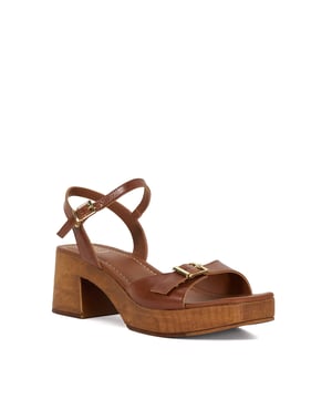 Tapping into this season's clog trend, Jeane rests on a wood-effect platform heel for all-day-comfort. Crafted from soft leather the adjustable ankle strap and front strap ensures the perfect fit.