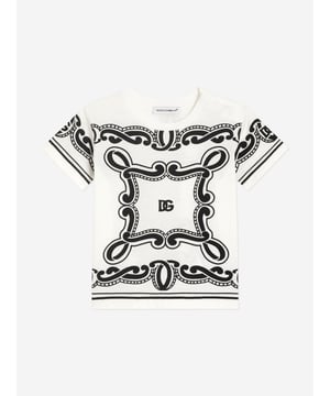 Introduce elegance early with Dolce Gabbana's Baby Boys Bandana Print T-Shirt in White, crafted for the discerning little dresser of SS2025. This Italian masterpiece marries high-end style with youthful charm Italian Excellence Impeccably fashioned in Italy, ensuring unmatched quality longevity. Charming Bandana Print Lends a playful yet fashion-forward appeal to your child's ensemble. Supreme Comfort Constructed from premium fabrics for all-day softness and ease. Elevate your little boy's wardrobe with this exquisite creation from Dolce Gabbana. Perfect for making a stylish statement.