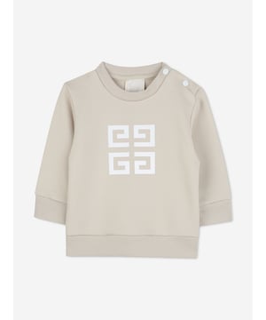 Givenchy incorporate sleek, enigmatic qualities into their lavish French abstracts. This baby boys cream sweatshirt is a Parisian staple piece to adore. Crafted from beautiful high quality cotton. It features a four '4G' print on the centre front via delicate ribbed trims. Round Neck Ribbed Trims Long Sleeves 85 Cotton, 15 Polyester