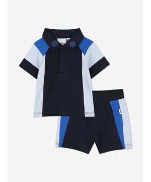Introducing the exquisite BOSS Baby Boys Short Set in Navy, a quintessential addition to any young gentleman's wardrobe for SS2025. Crafted with precision by BOSS, this set is the epitome of both style and comfort. Key features include Elegant Navy Hue A classic and versatile colour perfect for any occasion. Superior Comfort Crafted from premium fabrics to ensure your little one enjoys supreme comfort. Designer Quality Impeccable BOSS craftsmanship guarantees a durable and stylish ensemble. Elevate your child's fashion ensemble with this luxurious set.