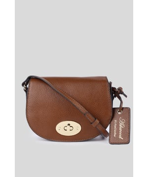 Elegance and sophistication come together in this beautifully crafted 'Borsa della Moda' saddle crossbody bag. Made with genuine leather, it showcases the high-quality craftsmanship associated with Ashwood Leather. Adorned with metallic gold hardware which not only adds to its aesthetic appeal but also ensures durability. The exquisite design makes it a perfect accessory for both day and night outings. Comes with a signature tag, marking its authenticity and brand association. Whether you're headed to a formal event or just out for a casual day, this 'Borsa della Moda' crossbody bag is sure to elevate your style quotient. Its versatile design allows it to be paired with various outfits, making it a must-have addition to your accessory collection.Dimensions (L) 17cm (W) 5.5cm (H) 14cm.