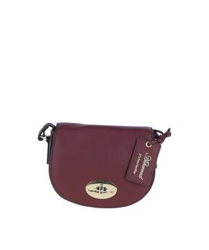 Elegance and sophistication come together in this beautifully crafted 'Borsa della Moda' saddle crossbody bag. Made with genuine leather, it showcases the high-quality craftsmanship associated with Ashwood Leather. Adorned with metallic gold hardware which not only adds to its aesthetic appeal but also ensures durability. The exquisite design makes it a perfect accessory for both day and night outings. Comes with a signature tag, marking its authenticity and brand association. Whether you're headed to a formal event or just out for a casual day, this 'Borsa della Moda' crossbody bag is sure to elevate your style quotient. Its versatile design allows it to be paired with various outfits, making it a must-have addition to your accessory collection.Dimensions (L) 17cm (W) 5.5cm (H) 14cm.