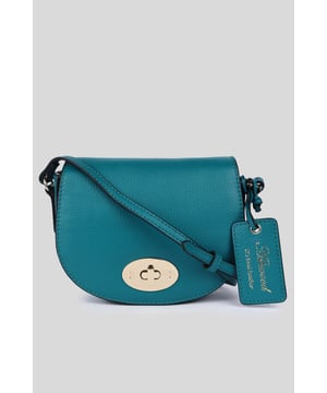 Elegance and sophistication come together in this beautifully crafted 'Borsa della Moda' saddle crossbody bag. Made with genuine leather, it showcases the high-quality craftsmanship associated with Ashwood Leather. Adorned with metallic gold hardware which not only adds to its aesthetic appeal but also ensures durability. The exquisite design makes it a perfect accessory for both day and night outings. Comes with a signature tag, marking its authenticity and brand association. Whether you're headed to a formal event or just out for a casual day, this 'Borsa della Moda' crossbody bag is sure to elevate your style quotient. Its versatile design allows it to be paired with various outfits, making it a must-have addition to your accessory collection.Dimensions (L) 17cm (W) 5.5cm (H) 14cm.