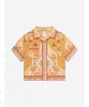 Australian label Zimmermann redefine the strategy of fashion by exploring their own identity that is neither trend-driven nor futuristic. This girls Wylie pocket shirt is woven in beautiful lightweight cotton in orange, beige and yellow shades, with a refined vintage style print. Soft and semi-sheer, it has a Cuban collar, a chest pocket, and button fastenings. 100 Cotton