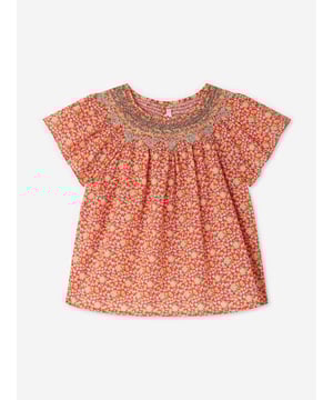 Introducing the Girls Smocked Nella Blouse in Red by Bonpoint, a quintessential addition to your young lady's SS2025 wardrobe. Each detail is meticulously crafted for exquisite allure Iconic Red Hue Radiates charm style. Elegant Smocking Adds a touch of classic refinement. Breathable Fabric Ensures comfort freedom. Versatile Design Perfect for any occasion, from park plays to grand parties.Elevate her ensemble with this striking piece!