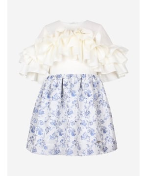 Introducing the quintessential addition to your little lady's wardrobe for SS2025 the Girls Floral Jacquard Flutterby Ruffle Dress in Blue by Jessie and James. Masterfully crafted in an enchanting blue tone, this piece blends classic charm with contemporary flair, perfect for any occasion. Key features include Exquisite Floral Jacquard Elevates the dress with luxurious texture and vibrant visual appeal. Delightful Flutterby Ruffles Cascading ruffles add a whimsical touch, ensuring she feels like the belle of the ball. Supreme Comfort Expertly tailored to ensure all-day comfort, blending elegance with ease.Refresh her closet with this stunning Jessie and James creation. Order now for a stylish season ahead!