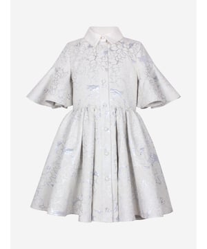 Jessie and James embody timeless elegance and modern charm. Crafted with a sophisticated jacquard floral print, this girls little sister blue clouds jacquard dress combines classic style with contemporary flair. Woven in ice blue. It showcases a front button fastening, classic collar, flared cuffs, and an elegant peplum hem. Outer Polyester 50, Cotton 39, Metallic Fibre 11 Lining Cotton 100