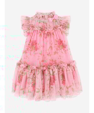 Angel's Face depict mesmeric high quality in their beautifully crafted designs. This girls Marigold begonia pink and green occasion dress is woven in voluminous layers of floral printed soft tulle. It is detailed with the signature bow and gold heart charm on the neckline, fastening at the back with a gold logo button. Shell 100 Polyester Lining 50 Cotton, 50 Viscose Modal Machine Wash At 30