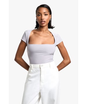 Double-layered bodysuit for enhanced comfort and coverage
        Square neckline adds a modern, geometric touch
        Short sleeves offer versatility for various occasions
        Form-fitting silhouette accentuates curves
        Seamless design ensures a smooth look under clothing
    
    This chic double-layered bodysuit from Boohoo is a wardrobe essential that combines style with practicality. The square neckline presents a contemporary edge, while the short sleeves provide adaptability for different seasons. Perfect for casual outings, this bodysuit can be effortlessly paired with high-waisted trousers or a flowing skirt for a polished look. Layer it under a blazer for family gatherings or team it with your favourite denim for a relaxed weekend ensemble. The form-fitting silhouette flatters your figure, making it an ideal base for countless outfits. Whether you're heading to a casual lunch or a laid-back evening with friends, this versatile piece will keep you looking stylish and feeling confident.