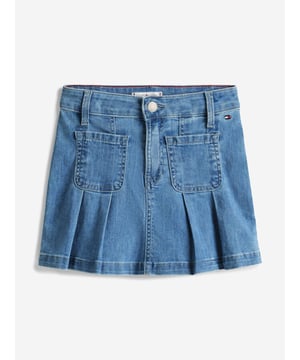 Introducing the Tommy Hilfiger Girls Pleated Denim Skirt in Blue an essential addition for SS2025. Crafted with flair, this skirt encapsulates both comfort and fashion for your young one. Key features include Classic Pleated Design Chic pleats merge timeless style with a fresh, youthful twist. Vibrant Blue Hue A striking blue shade complements any top, ensuring versatility across seasons. Quality Denim Fabrication Durably constructed to withstand the joys of childhood. Signature Branding Embellished with the iconic Tommy Hilfiger logo for an exquisite touch.Revitalize your girl's wardrobe with this delightful, versatile piece.