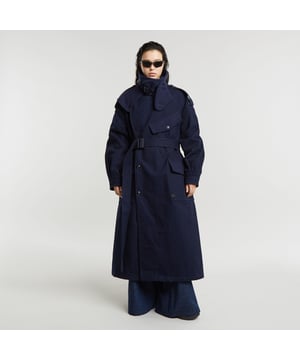 Lapel collar, option for raised collar with detachable throat latch. Button closure, woven belt. Flap pockets at the chest and waist, snap button closure. Cuffs with snap buttons. Broad epaulettes, ventilation panel at the back. Button closure. This Maxi coat is designed in the G-Star RAW Research lab. Offering a unisex trenchcoat with exaggerated proportions, visible through the epaulettes on the shoulders. By use of the strap, the collar can be placed upwards. Apply the detachable throat latch for even more wind protection. 100% Cotton. Japanese canvas weave, compact woven. LOOSE