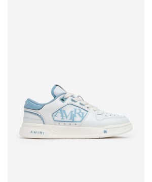 Introducing the Kids Leather Classic Low Trainers in Blue by Amiri, an essential addition to any chic young wardrobe for SS2025. These trainers exude luxury while ensuring comfort for all day wear. Discover why they're a must-have Premium Blue Leather Crafted with the finest leather for lasting elegance and durability. Versatile Style Perfect for both boys and girls, these trainers elevate any outfit. Superior Comfort Designed to support young feet during any activity. Elevate your child's style with Amiri's craftsmanship. Order today!