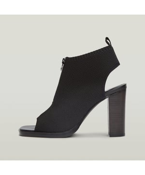 Block heel. Open heel and toe. Pull tab at the back. Elastic band/Slip on. High heel Panzer Knit offers a comfortable sandal with an open heel and toe construction. A zipper closure and pull tab allow for an easy access. 92% Cotton, 8% Polyester. Knitted texture. This product can not be washed.