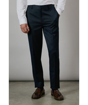 Textured fabric adds subtle dimension and visual interest to these classic suit trousers
        Slim fit design creates a modern, streamlined silhouette that flatters the leg
        Stretch fabric blend allows for comfortable movement throughout the day
        Clean front styling with side pockets for a sleek, professional appearance
        Versatile dark navy shade pairs effortlessly with various shirt and jacket combinations
    
    These Burton textured stretch trousers deliver the perfect balance of style and comfort for the modern gentleman. The slim fit contours to your frame without feeling restrictive, thanks to the added stretch that ensures ease of movement whether you're presenting in the boardroom or enjoying after-work drinks. The dark navy hue offers tremendous versatility, working brilliantly with a matching jacket for formal occasions or paired with a crisp white shirt and brown leather shoes for smart-casual events. The textured fabric adds subtle character that distinguishes these trousers from ordinary suit bottoms. Perfect for the man who appreciates classic styling with contemporary comfort, these trousers will quickly become a cornerstone of your professional wardrobe. Ideal for weddings, important meetings, or any occasion where making a refined impression matters.